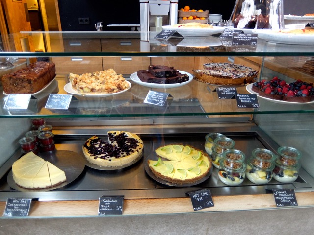 Cakes, pastries, fruit, and granola displayed at Elbgold
