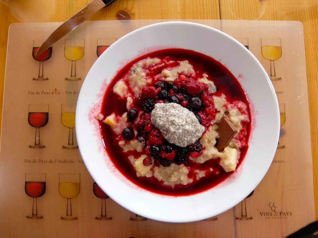 Breakfast oatmeal with chia seeds, chocolate, and hot berries