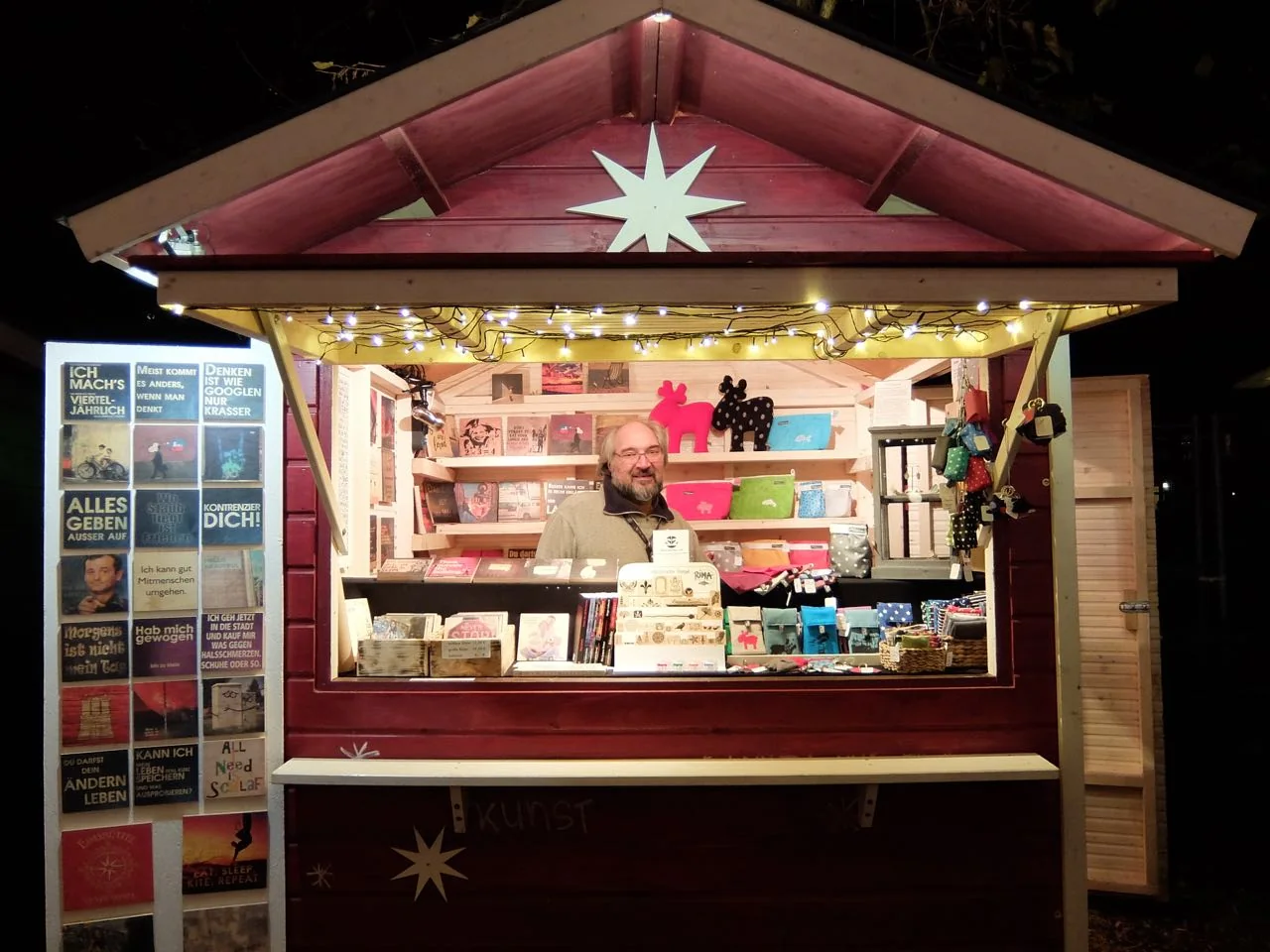 Signs and locally made goods at the Apostelkirche Christmas market